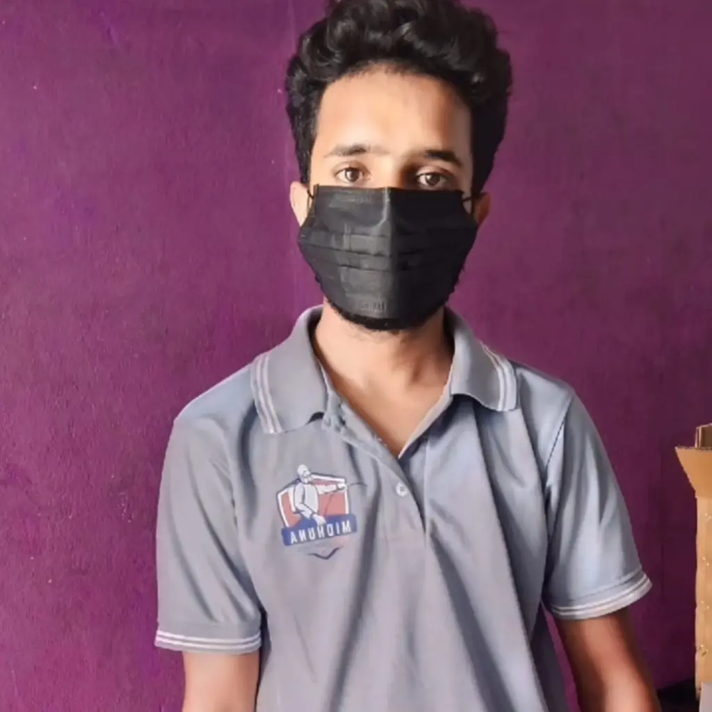 Midhuna Pest Control technician wearing mask and uniform